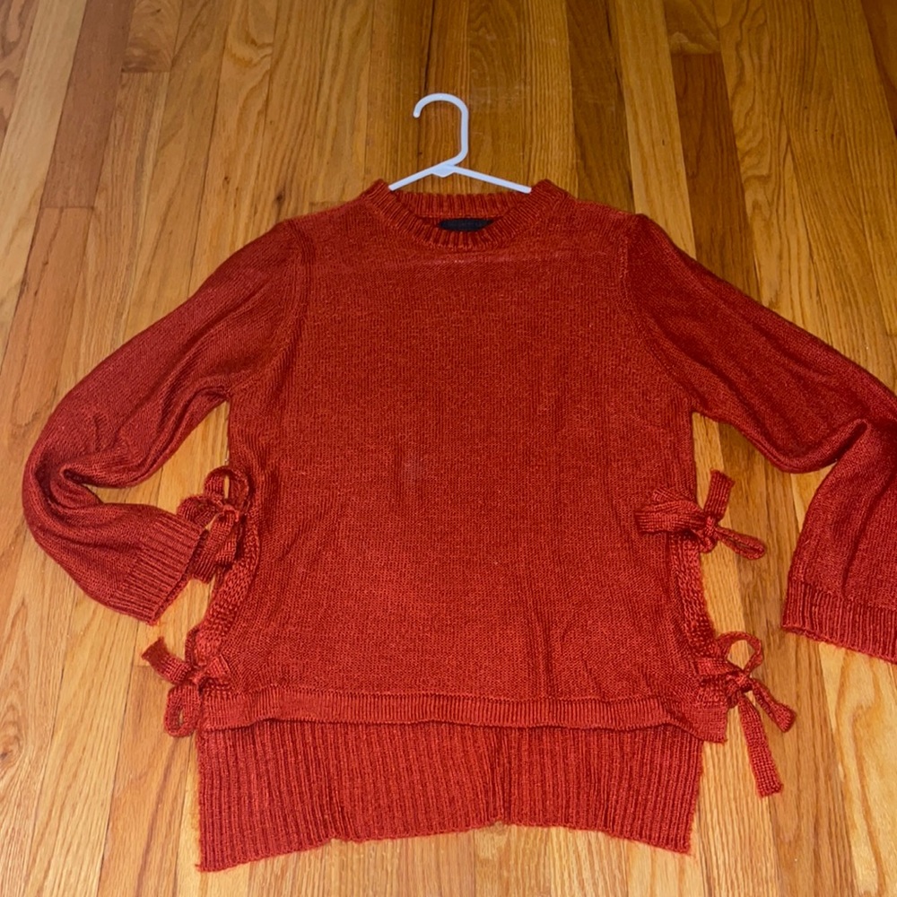 Beautiful red knit sweater with bow ties